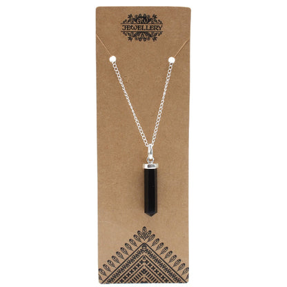 Necklace with a black pendant on a brown card with 'Jewellery' branding.