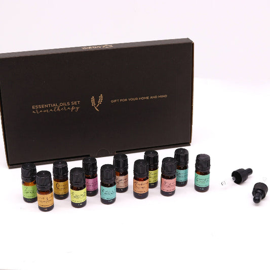 Essential oils set with a black gift box on a white background