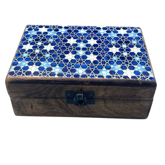 Wooden box with a blue and white mosaic lid on a white background