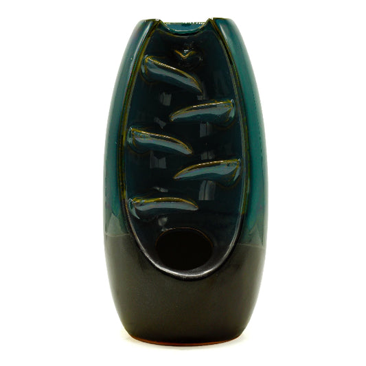 Green ceramic vase with textured surface on a white background