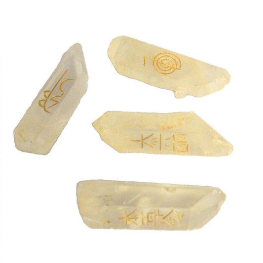 Five pieces of white stone with gold text on a white background