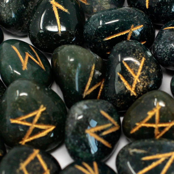 Green stones with yellow markings on a white background