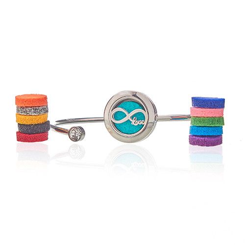 Bangle with colorful stripes and a central circular charm on a white background