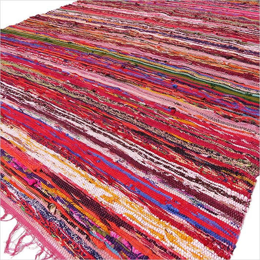 Multicolored striped rug with fringes on a white background
