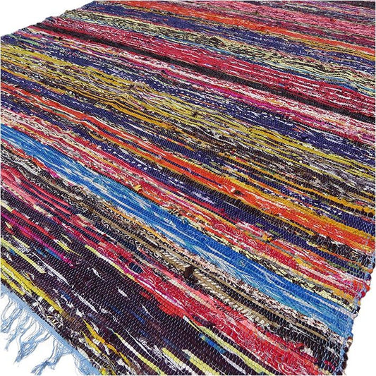 Multicolored woven rug with fringes on a white background