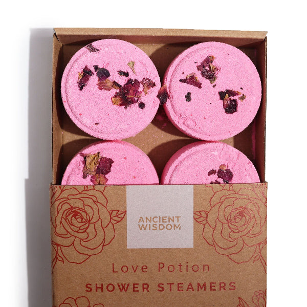 Four pink shower steamers with dried flowers in a 'Ancient Wisdom' box.