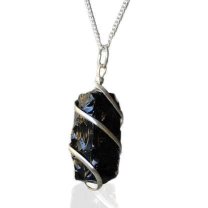 Necklace with a black crystal pendant on a white background