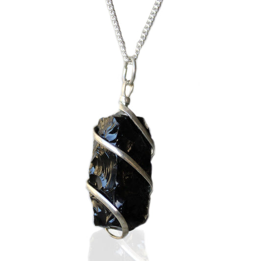 Necklace with a black crystal pendant on a white background