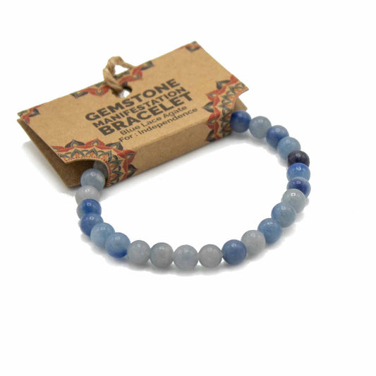 Blue gemstone bracelet with a cardboard packaging label on a white background
