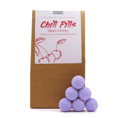 Purple bath bombs with a brown box labeled 'Chill Pills - Black Cherry' on a white background