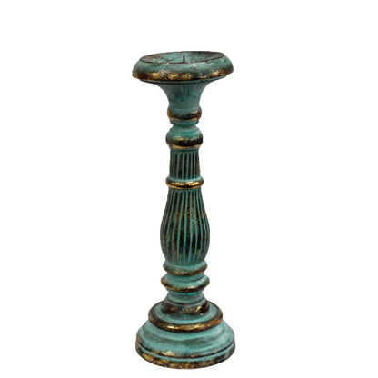 Decorative teal candle holder with gold accents on a white background