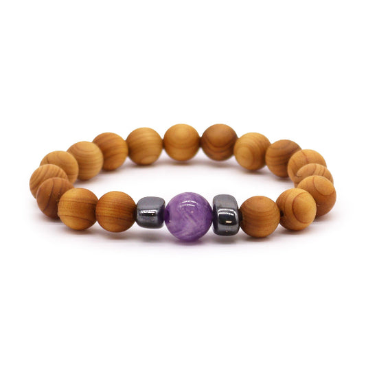 Wooden beaded bracelet with purple and silver beads on a white background