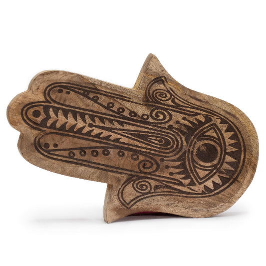 Wooden toy with snake design on a white background