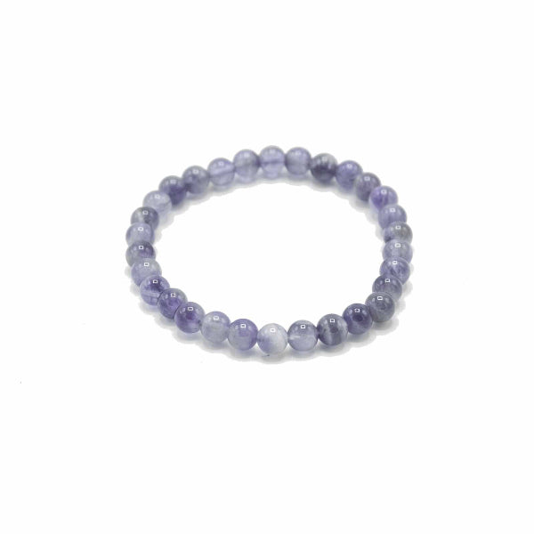 Beaded bracelet with purple and white stones on a white background
