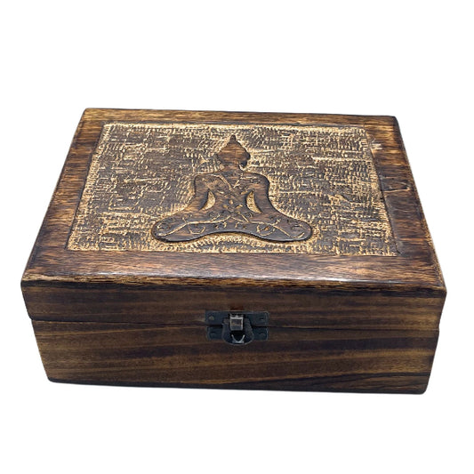 Wooden box with a engraved design on a white background