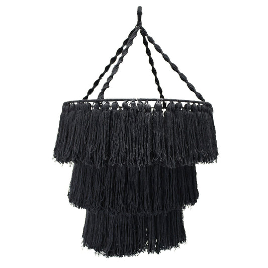 Black fringe lampshade with braided handle on a white background