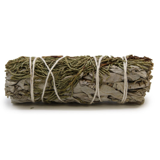 Rolled sage bundle tied with twine on a white background