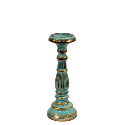 Decorative candle holder with turquoise and gold finish on a white background