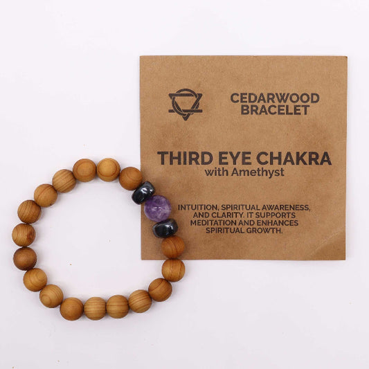 Wooden bracelet with embedded stones on a 'Cedarwood Bracelet' packaging.