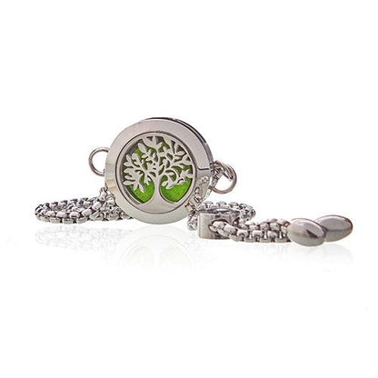 Silver bracelet with a tree of life charm on a white background