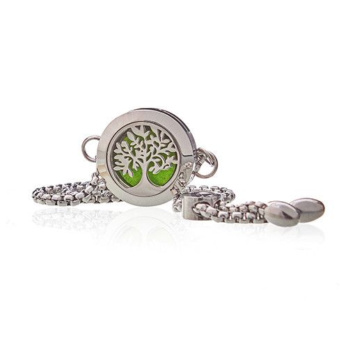 Silver bracelet with a tree of life charm on a white background
