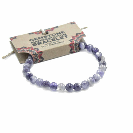 Purple beaded bracelet on a white background with a branded card behind it