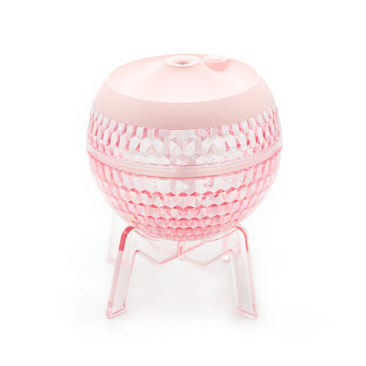 Pink textured diffuser on a white background