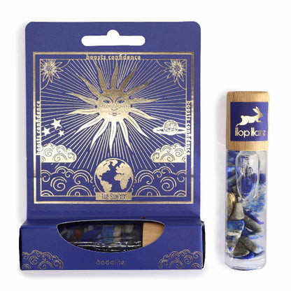 Blue packaging with celestial design and a cylindrical product with rabbit illustration on a white background