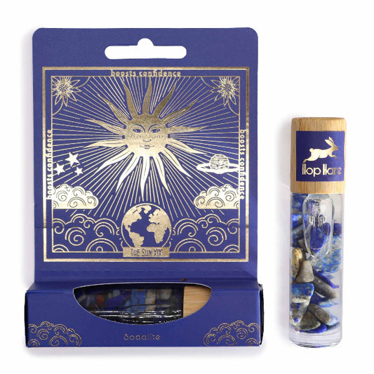 Blue packaging with celestial design and a cylindrical product with rabbit illustration on a white background