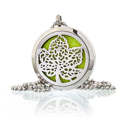 Silver locket with a leaf design on a white background