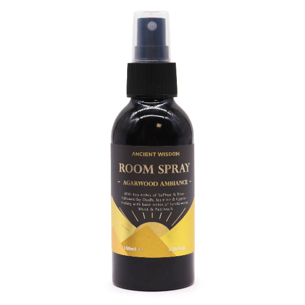 Room spray bottle with black and yellow label on a white background