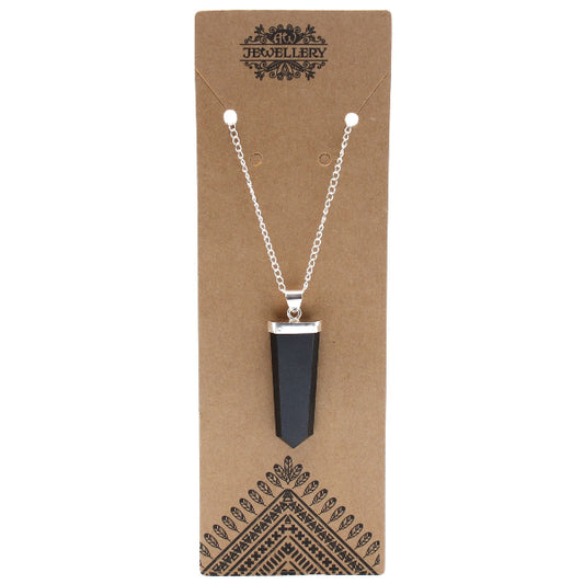 Necklace with a black pendant on a brown jewelry card