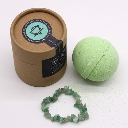 Green bath bomb, bracelet, and packaging on a white background