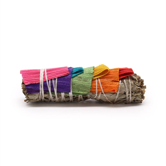 Colorful woven sage bundle on a white background
