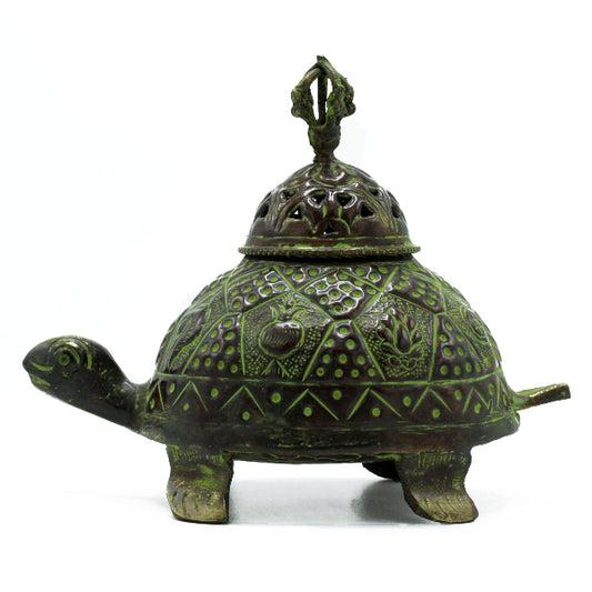 Decorative turtle-shaped object with a lid on a white background