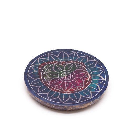 Round stone with a colorful mandala design on a white background