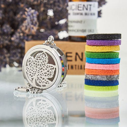 Decorative silver locket with colorful hair ties on a reflective surface.