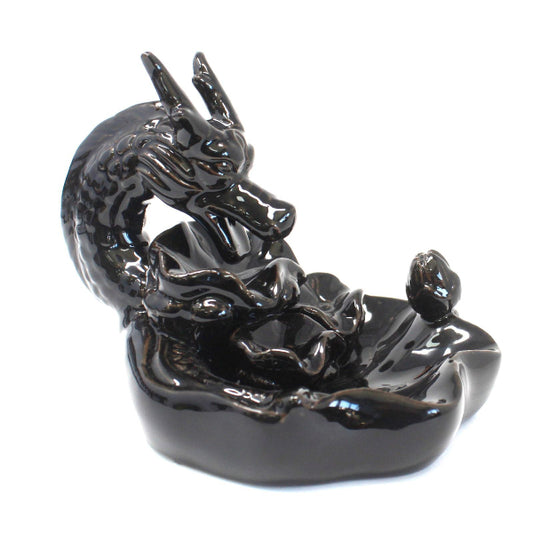 Black dragon figurine on a white background