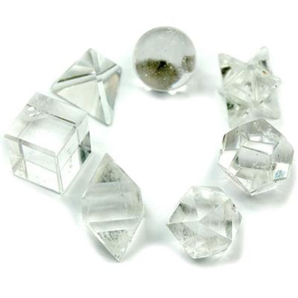 Clear crystal geometric shapes on a white background