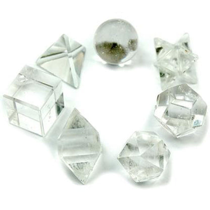 Clear crystal geometric shapes on a white background
