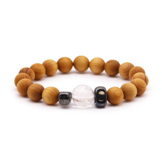 Wooden beaded bracelet with black, clear, and gold focal beads on a white background