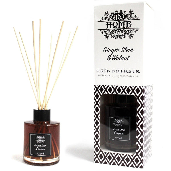 Reed diffuser with ginger stem and walnut scent next to its packaging on a white background