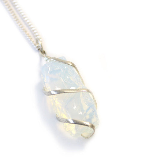 Opal pendant with silver wire wrapping on a white background