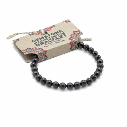 Black beaded bracelet with a label on a white background