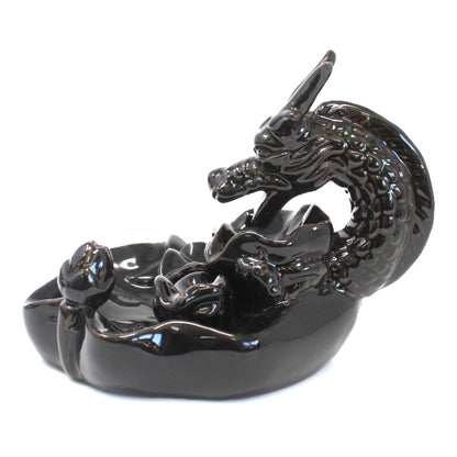 Black dragon-shaped incense burner on a white background