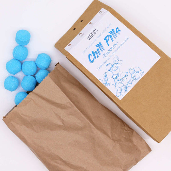 Box of 'Chill Pills' with blue balls on a white background