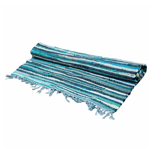 Striped blue and green towel with tassels on a white background