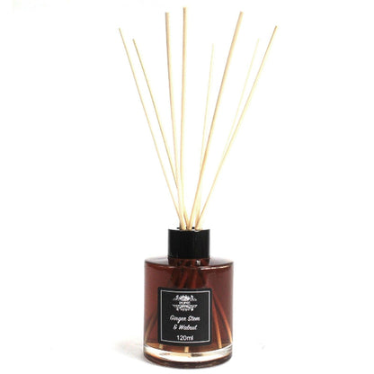 Reed diffuser with wooden sticks and a label on a white background