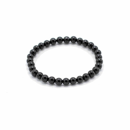 Black beaded bracelet on a white background