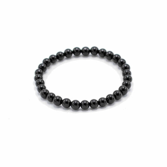 Black beaded bracelet on a white background